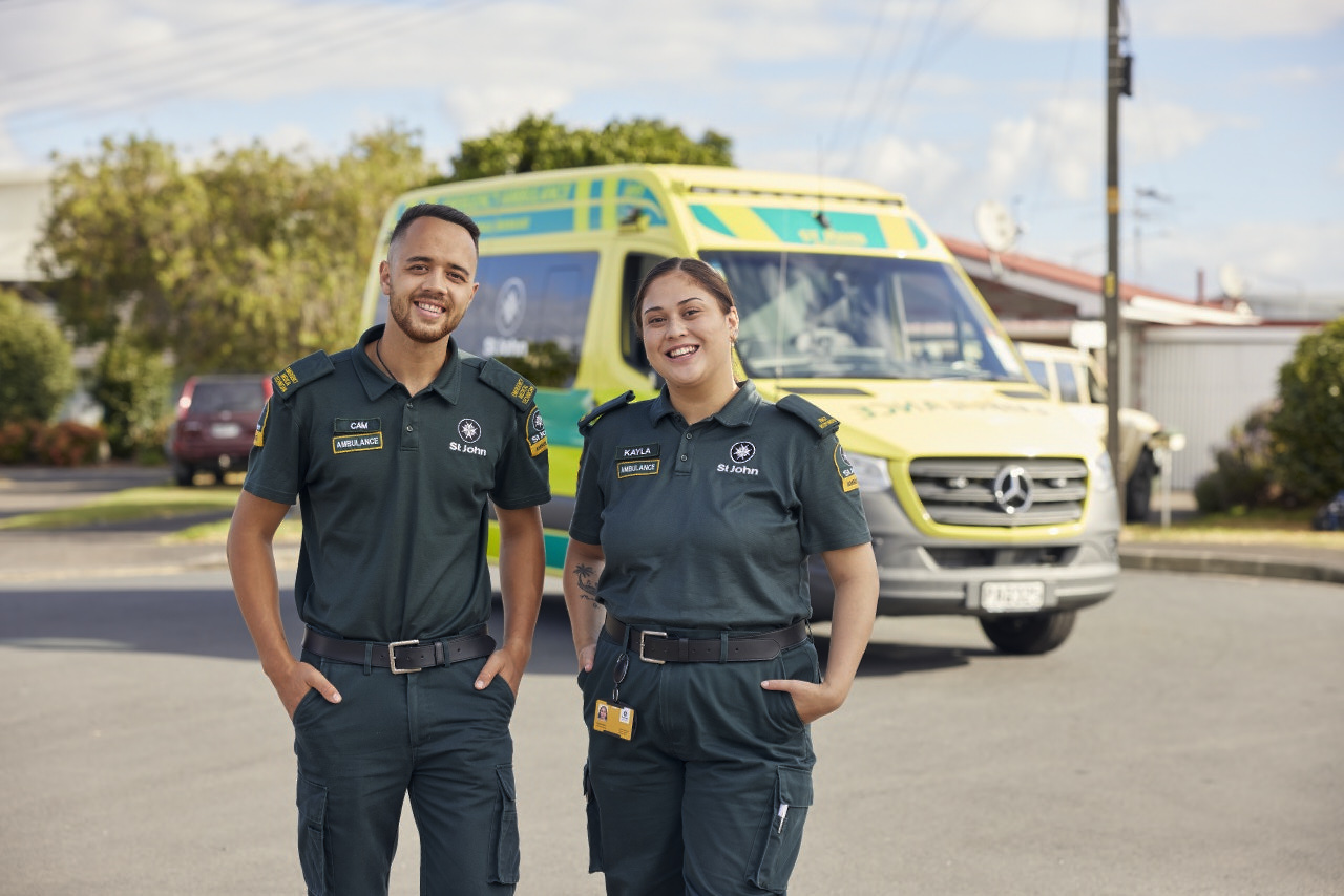 Ambulance officers in front of an ambulance