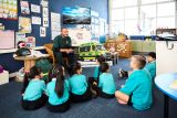 Young students learning about CPR