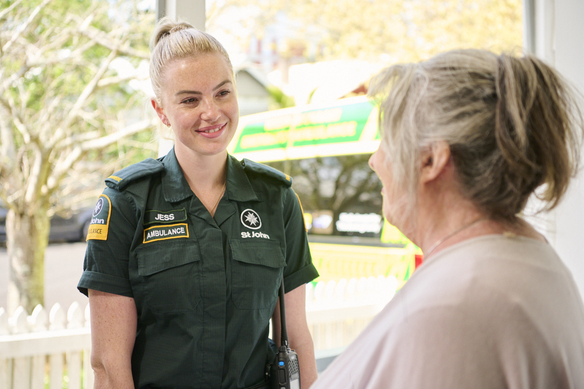 Paramedic smiling at patient