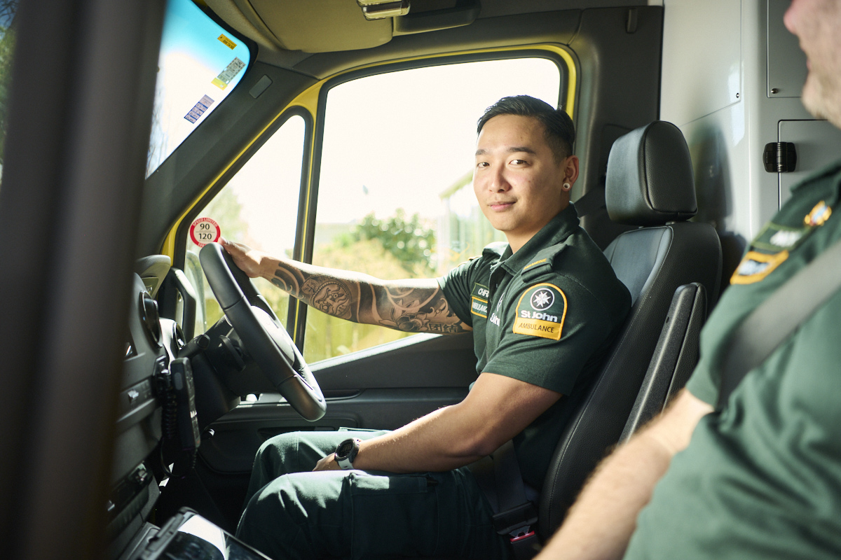 Two paramedics in the front of an ambulance