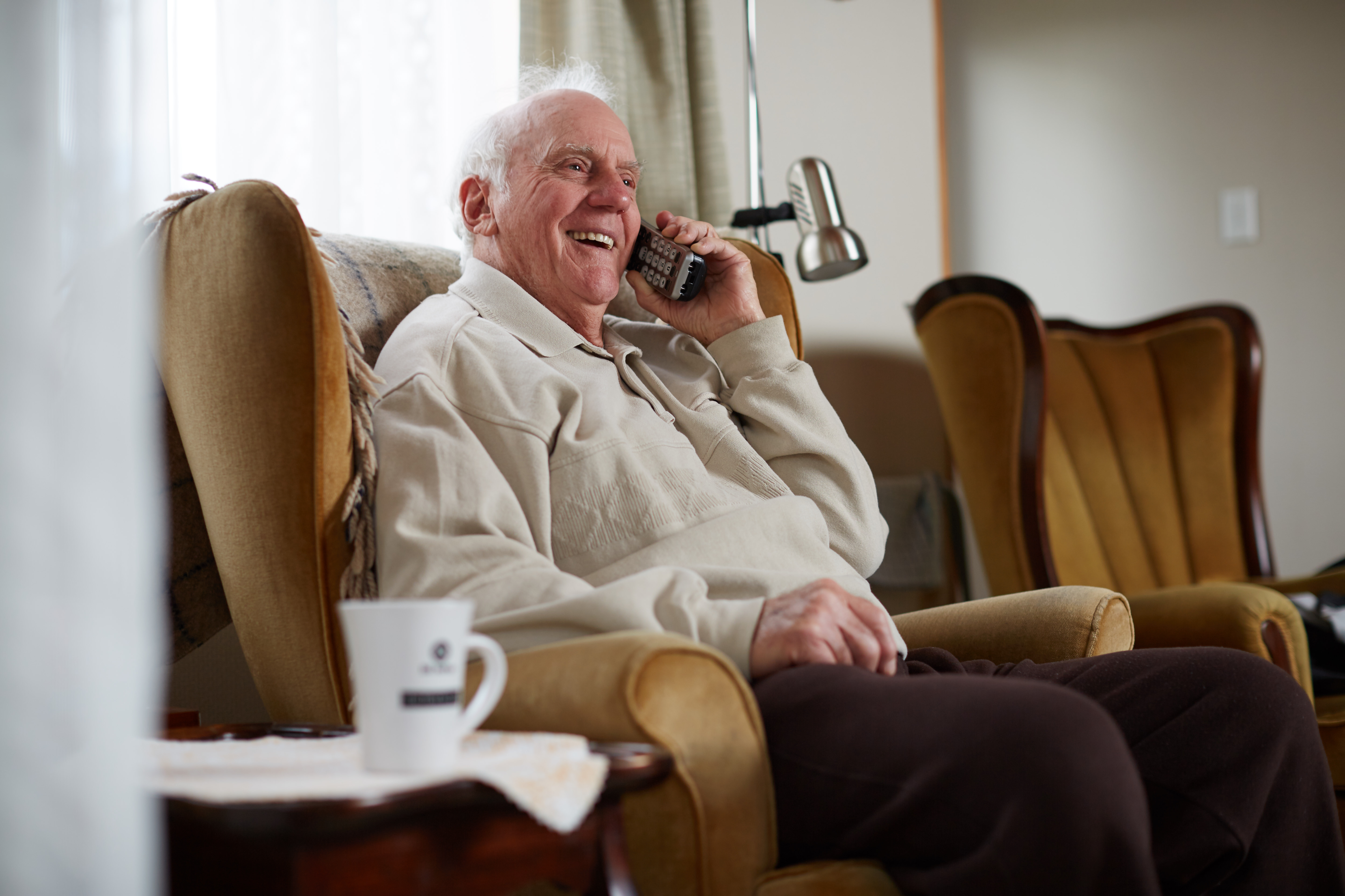Elderly man talking on the phone