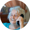 Elderly lady talking on the phone with a caring caller
