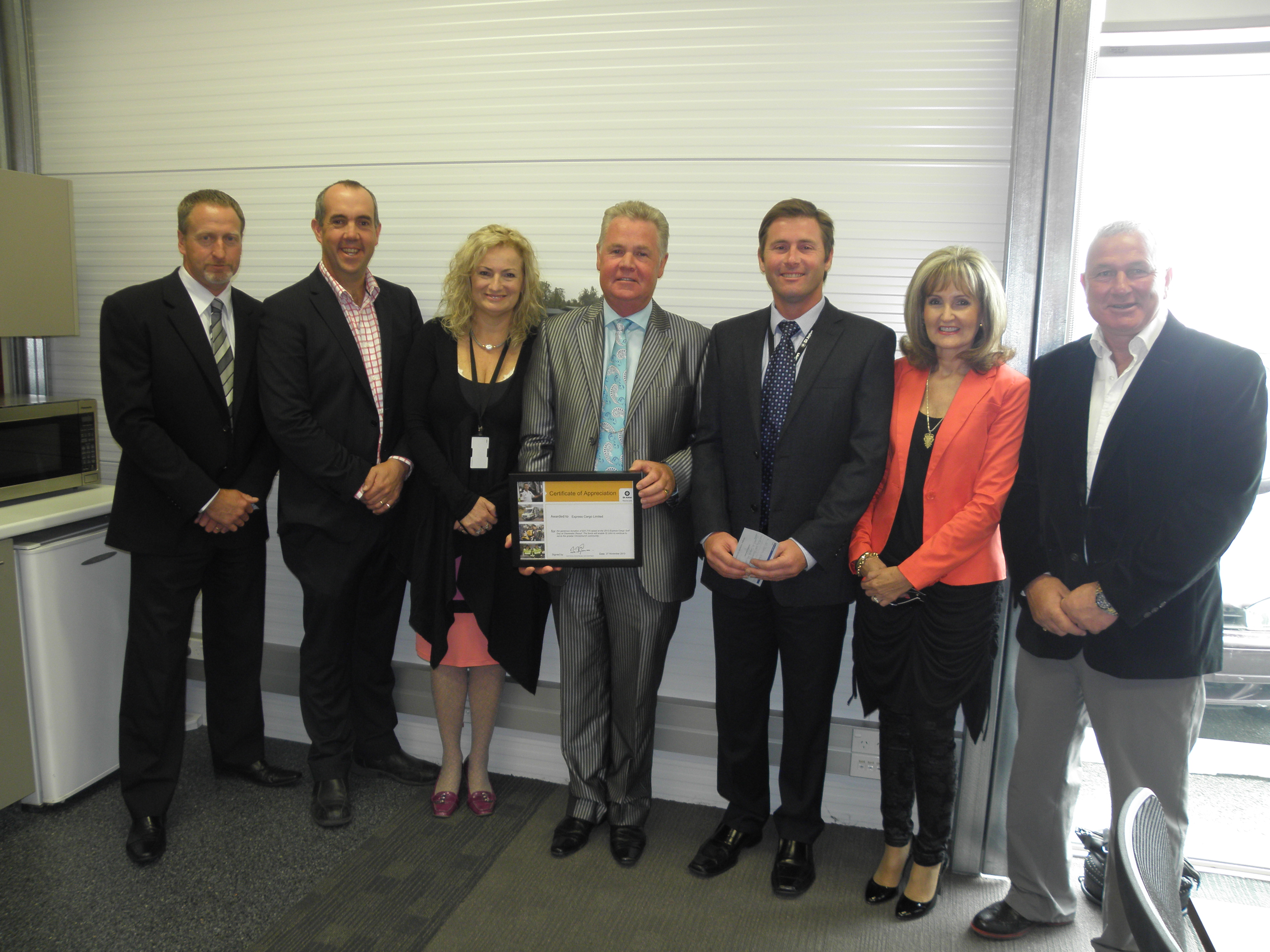 The Express Cargo team with Christine Prince (third from left) and Michael MacLachlan (third from right) of the South Island Region Customers and Services team.