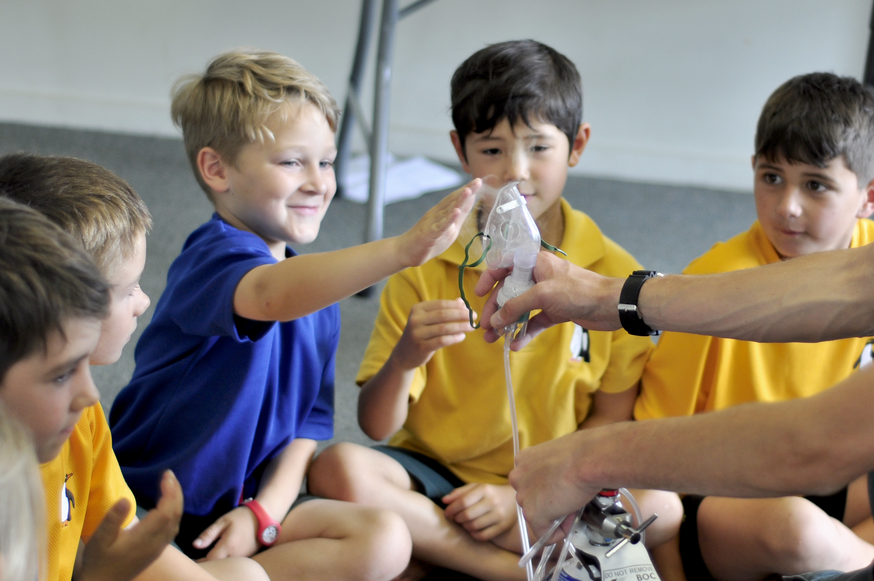 educator with primary school children teaching cpr