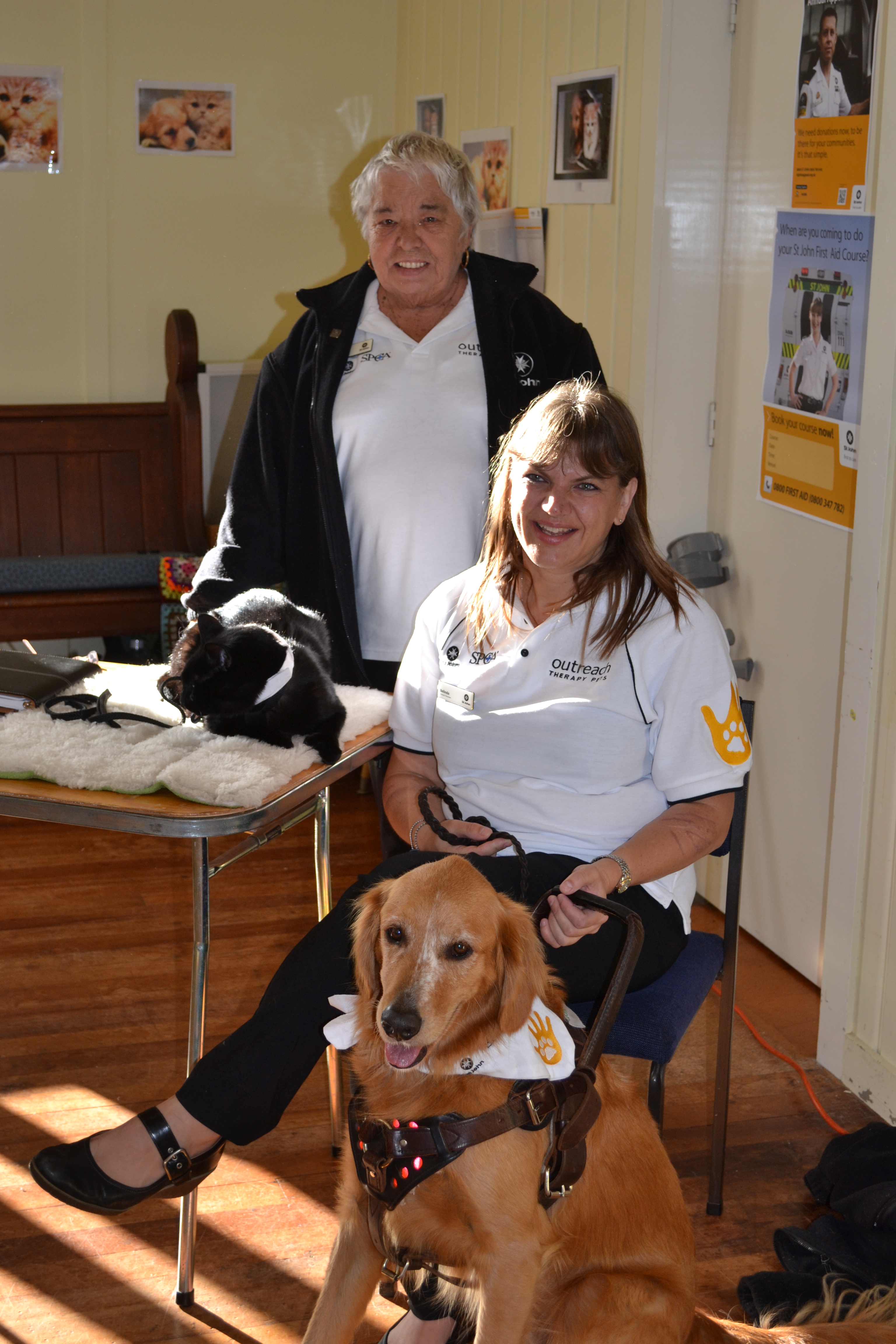 Sharon Mischefsky and Nunu the bull mastiff take time out during the Vodafone Warriors Emergency Services Heroes Day.